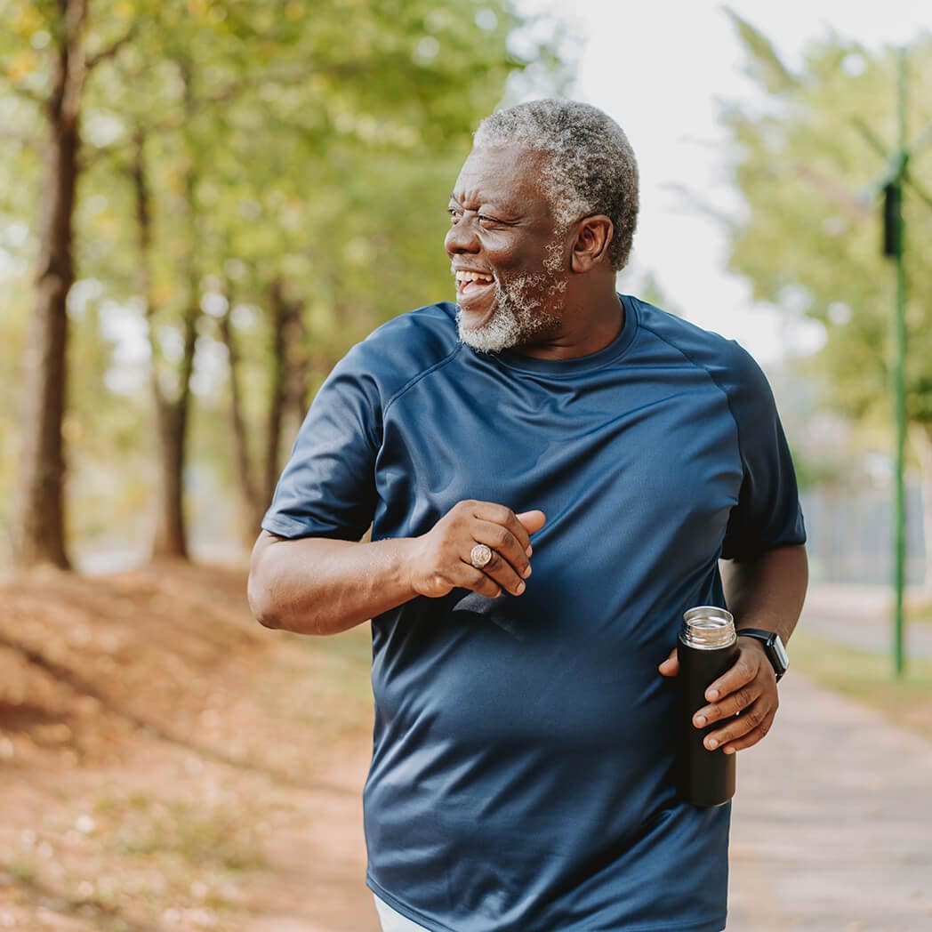 A man jogs through a park